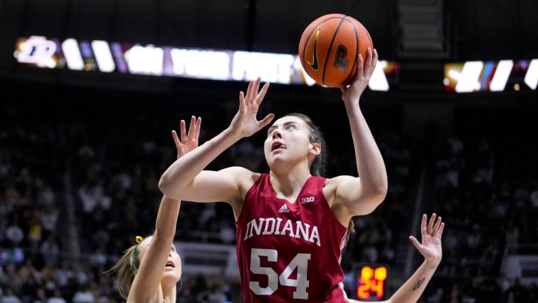 Indiana forward Mackenzie Holmes (54) shoots against Purdue in the first half of an NCAA college basketball game in West Lafayette, Ind., Sunday, Feb. 5, 2023. Holmes was honored as an All-American by The Associated Press on Wednesday, March 15, 2023. (Michael Conroy/AP)