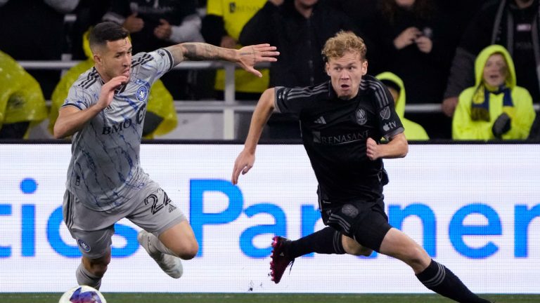 CF Montreal defender Aaron Herrera (22) and Nashville SC forward Jacob Shaffelburg vie for the ball in the first half of an MLS soccer game, (Mark Humphrey/AP)