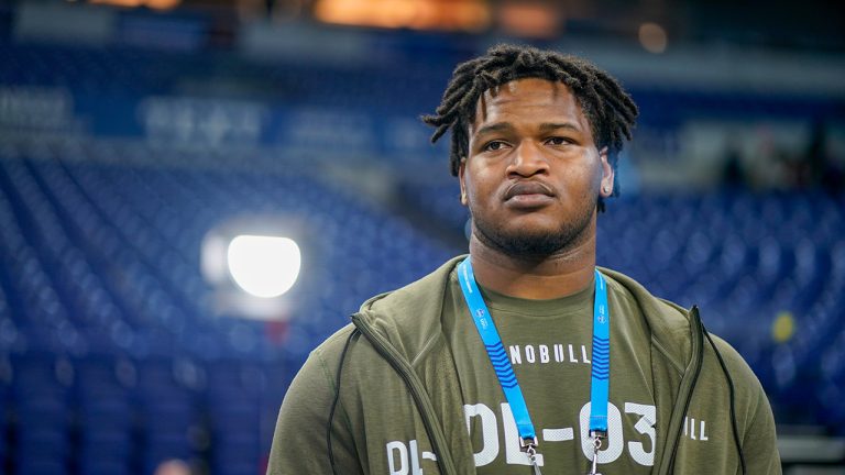 Georgia defensive lineman Jalen Carter watches as players warm up on the field before the NFL football scouting combine in Indianapolis, Thursday, March 2, 2023. (Darron Cummings/AP)