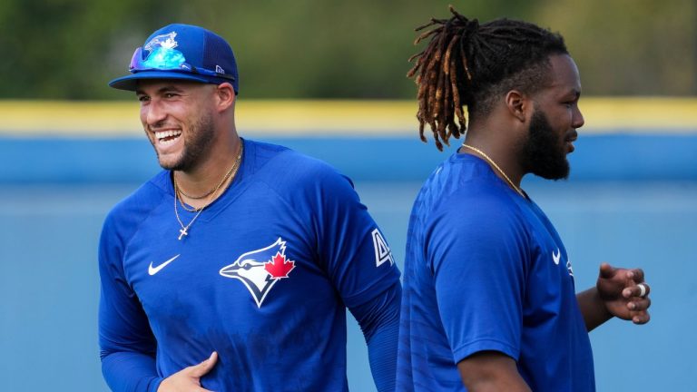 Toronto Blue Jays centre fielder George Springer, left, laughs next to Toronto Blue Jays first baseman Vladimir Guerrero Jr. during baseball spring training in Dunedin, Fla., Thursday, Feb. 23, 2023. (Nathan Denette/CP Photo)