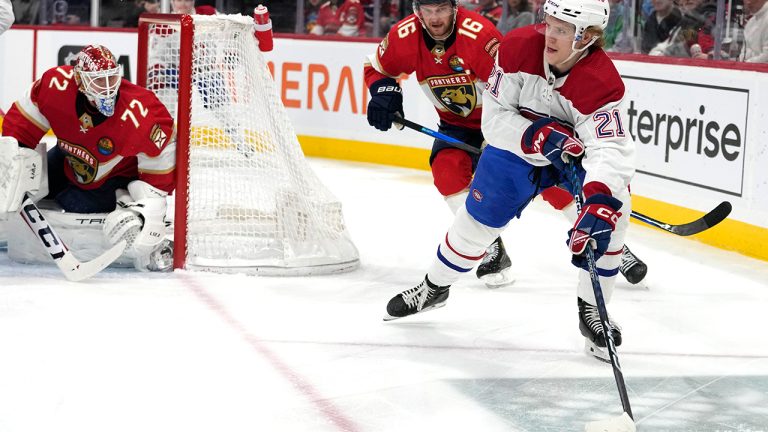 Montreal Canadiens defenseman Kaiden Guhle skates with the puck as Florida Panthers center Aleksander Barkov gives chase during the first period of an NHL hockey game, Thursday, Dec. 29, 2022, in Sunrise, Fla. (Lynne Sladky/AP)