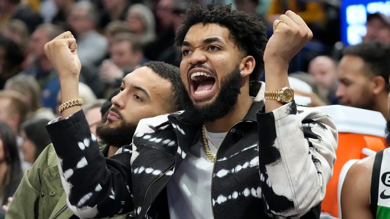 Minnesota Timberwolves center Karl-Anthony Towns (32) reacts from the bench during the second half of an NBA basketball game against the Utah Jazz Wednesday, Feb. 8, 2023, in Salt Lake City. (Rick Bowmer/AP)