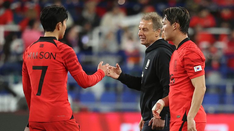 South Korea's head coach Jurgen Klinsmann, second from right, encourages South Korea's Son Heung-min, left, as South Korea's Oh Hyeon-gyu, right, walks after their friendly soccer match between South Korea and Colombia in Ulsan, South Korea, Friday, March 24, 2023. (Shin Hyun-woo/AP)