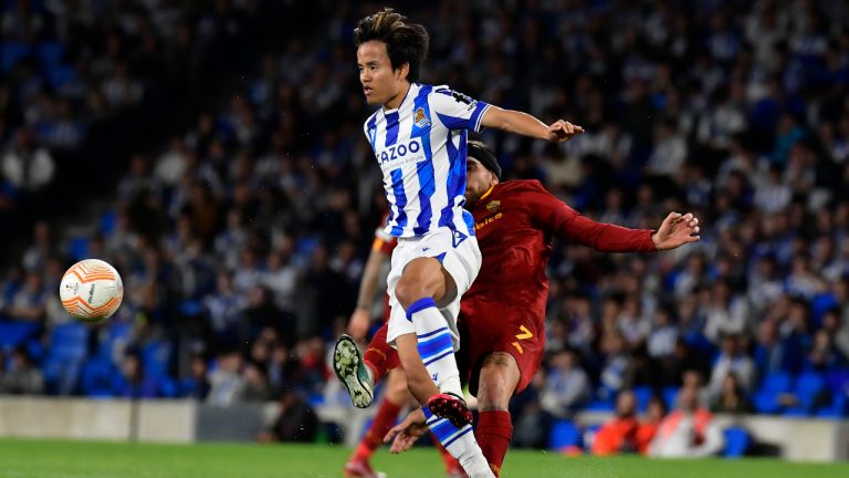 Real Sociedad's Takefusa Kubo, left, and Roma's Lorenzo Pellegrini challenge for the ball during the Europa League round of 16 second leg soccer match between Real Sociedad and Roma at the Reale Arena in San Sebastian, Spain, Thursday, March 16, 2023. (Alvaro Barrientos/AP)