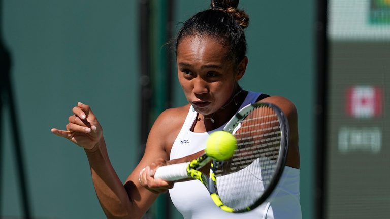 Leylah Fernandez, of Canada, returns to Caroline Garcia, of France, at the BNP Paribas Open tennis tournament Monday, March 13, 2023, in Indian Wells, Calif. (Mark J. Terrill/AP)