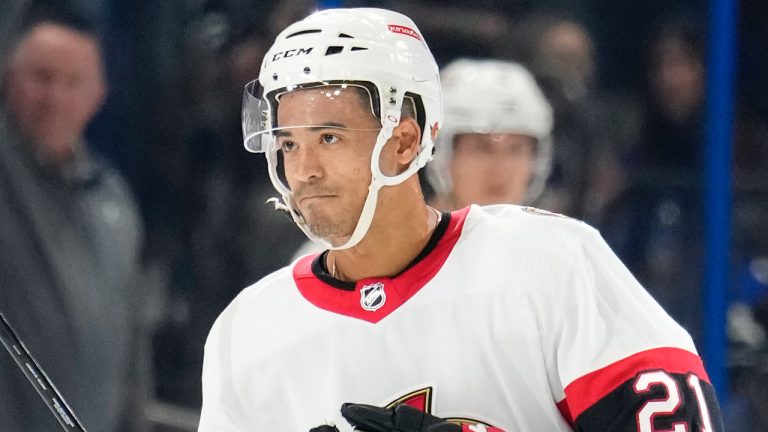 Ottawa Senators right wing Mathieu Joseph (21) reacts after the Tampa Bay Lightning played a video tribute to Joseph during the first period of an NHL hockey game Tuesday, Nov. 1, 2022, in Tampa, Fla. Joseph is a former Tampa Bay Lightning player. (Chris O'Meara/AP)