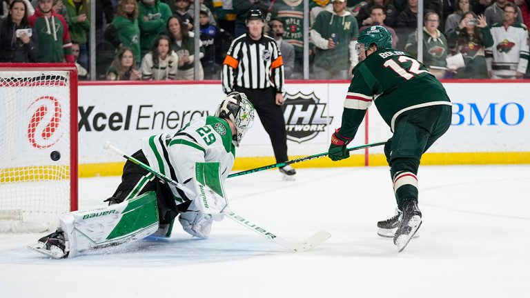 Minnesota Wild left wing Matt Boldy  shoots and scores a goal past Dallas Stars goaltender Jake Oettinger during a penalty shoot-out of an NHL hockey game Friday, Feb. 17, 2023, in St. Paul, Minn. (Abbie Parr/AP)