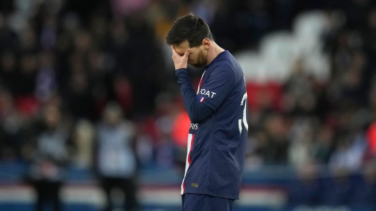 PSG's Lionel Messi touches his forehead in the final minutes of the French League One soccer match between Paris Saint-Germain and Rennes at the Parc des Princes in Paris, Sunday, March 19, 2023. (Christophe Ena/AP)