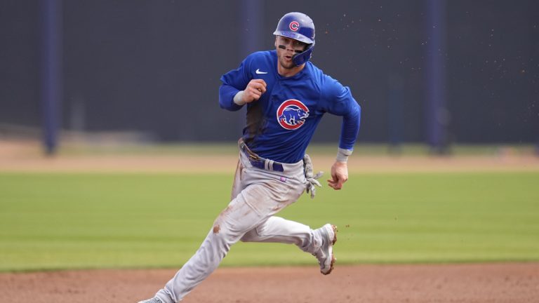 Chicago Cubs' Nico Hoerner runs the bases to score off an RBI-double by Eric Hosmer during the first inning of a spring training baseball game against the Seattle Mariners, Monday, March 6, 2023, in Peoria, Ariz. (Abbie Parr/AP)