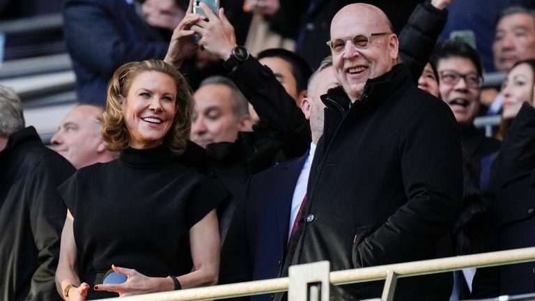 Manchester United's Chairman Avie Glazer, right, and Newcastle's Club Director Amanda Staveley, left, smile before English League Cup final soccer match between Manchester United and Newcastle United at Wembley Stadium in London, Sunday, Feb. 26, 2023. (Alastair Grant/AP)