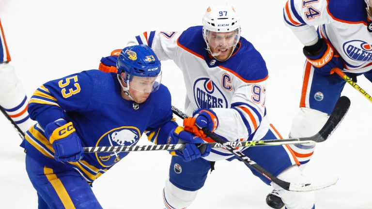 Buffalo Sabres left wing Jeff Skinner (53) and Edmonton Oilers center Connor McDavid (97) fight for position during the third period of an NHL hockey game, Monday, March 6, 2023, in Buffalo, N.Y. (Jeffrey T. Barnes/AP)