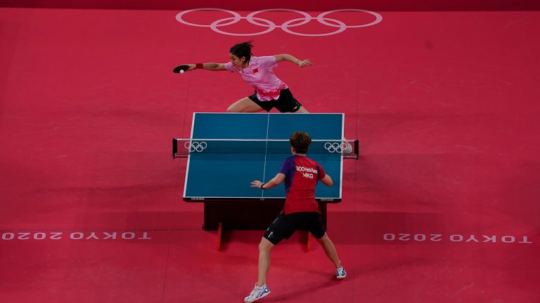 China's Chen Meng, top, and Doo Hoi-kem, of Hong Kong, compete in women’s single quarter-final Table Tennis action during the summer Tokyo Olympics in Tokyo, Wednesday, July 28, 2021.(Nathan Denette/CP)