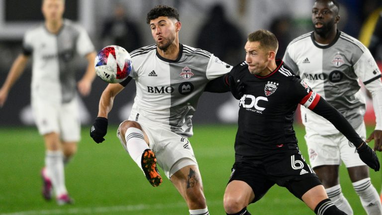 Toronto FC midfielder Jonathan Osorio, left, and D.C. United midfielder Russell Canouse (6) battle for the ball during the first half of an MLS soccer match, Saturday, Feb. 25, 2023, in Washington. (Nick Wass/AP)