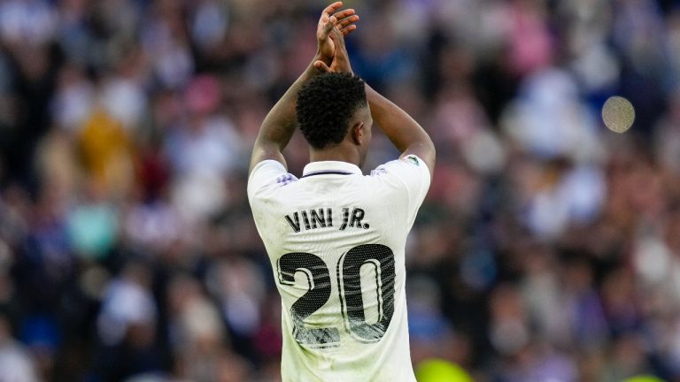 Real Madrid's Vinicius Junior acknowledges the crowd at the end of a Spanish La Liga soccer match between Real Madrid and Espanyol at the Santiago Bernabeu stadium in Madrid, Spain, Saturday, March 11, 2023. (Bernat Armangue/AP)