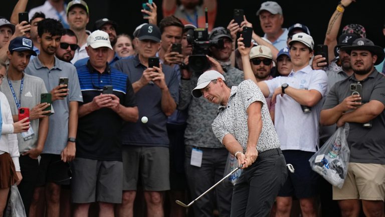 Rory McIlroy, of Northern Ireland, center, chips to the green on the sixth hole during the second round of the Dell Technologies Match Play Championship golf tournament in Austin, Texas, Thursday, March 23, 2023. (Eric Gay/AP)