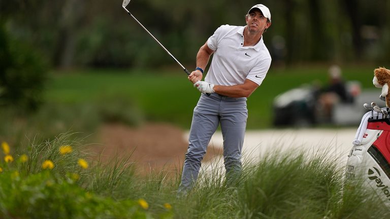 Rory McIlroy, of Northern Ireland, watches his shot from the rough on the 15th fairway during the first round of the Players Championship golf tournament Thursday, March 9, 2023, in Ponte Vedra Beach, Fla. (Eric Gay/AP)