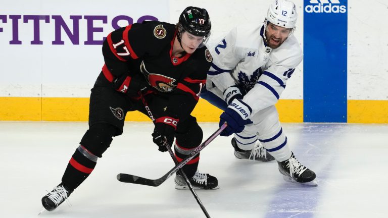 Toronto Maple Leafs centre Zach Aston-Reese (12) reacts as Ottawa Senators centre Ridly Greig steals the puck from him at the blue line during first period NHL action in Ottawa, Saturday, March 18, 2023. (Adrian Wyld/CP)