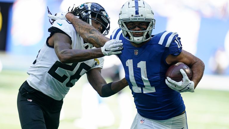 Indianapolis Colts' Michael Pittman Jr.  runs past Jacksonville Jaguars' Shaquill Griffin during the first half of an NFL football game, Sunday, Oct. 16, 2022, in Indianapolis. (Michael Conroy/AP)