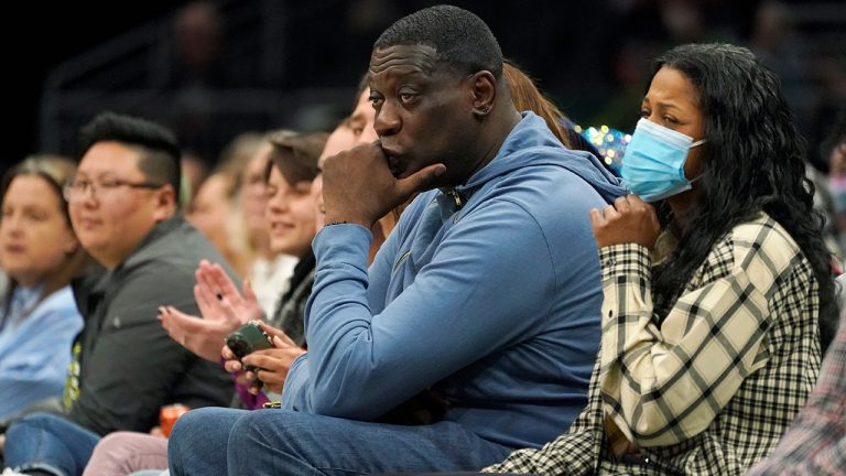 Former Seattle SuperSonics forward Shawn Kemp, center, attends a WNBA basketball game between the Seattle Storm and the Chicago Sky, Wednesday, May 18, 2022 in Seattle. (Ted S. Warren/AP)