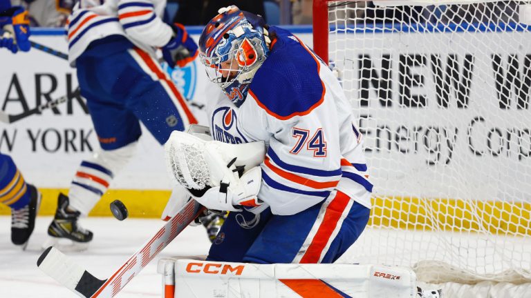 Edmonton Oilers goaltender Stuart Skinner (74) makes a save during the first period of an NHL hockey game against the Buffalo Sabres, Monday, March 6, 2023, in Buffalo, N.Y. (Jeffrey T. Barnes/AP)