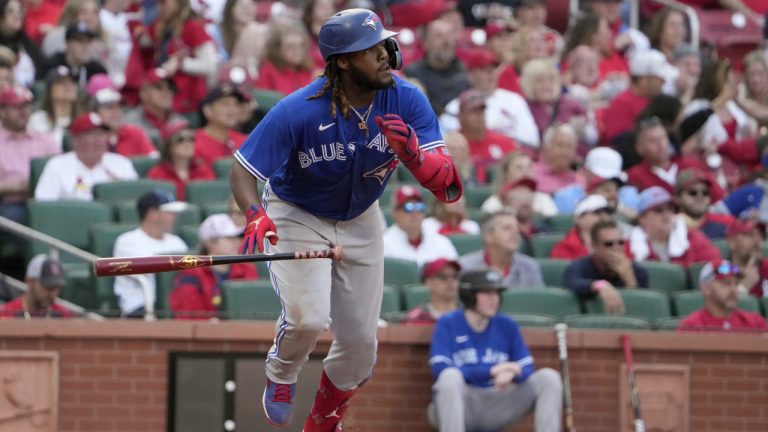 Toronto Blue Jays' Vladimir Guerrero Jr. follows through on a two-run single during the eighth inning of an opening day baseball game against the St. Louis Cardinals Thursday, March 30, 2023, in St. Louis. (Jeff Roberson/AP)