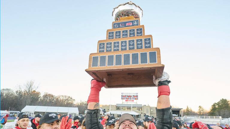 Laval’s Antoine Dean Rios hoist the Vanier Cup following the Rouge et Or’s victory over the Saskatchewan Huskies at Alumni Stadium in London, Ont., Saturday, Nov. 26, 2022. (Geoff Robins/CP)