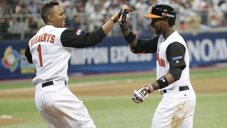 Netherlands's Jurickson Profar, right, celebrate with Xander Bogaerts after winning against Taiwan at the first round game of the World Baseball Classic at Gocheok Sky Dome in Seoul, South Korea, Wednesday, March 8, 2017. (Ahn Young-joon/AP).