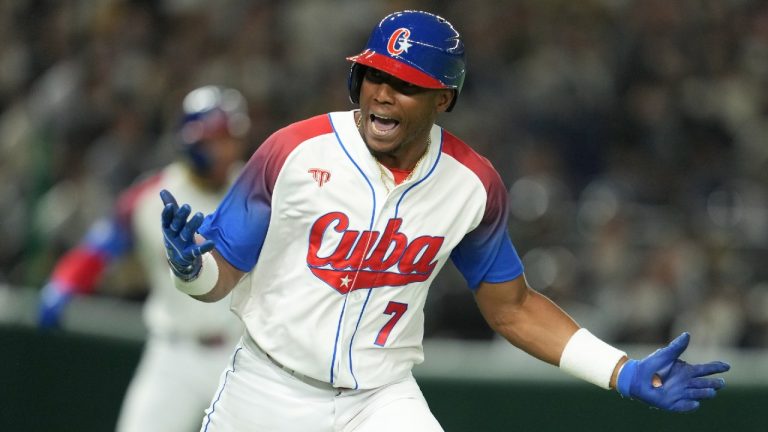 Yoelkis Guibert of Cuba reacts as he runs between bases during the World Baseball Classic quarterfinal game between Cuba and Australia at the Tokyo Dome Tokyo, Wednesday, March 15, 2023. (Toru Hanai/AP)