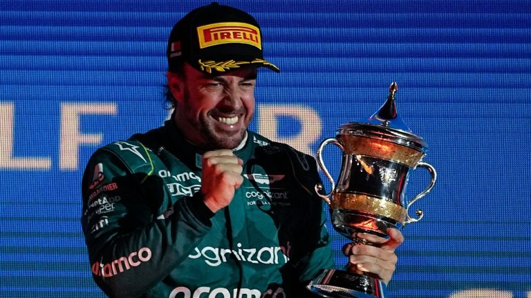 Aston Martin driver Fernando Alonso of Spain celebrates after he took third place at the Formula One Bahrain Grand Prix at Sakhir circuit, Sunday, March 5, 2023. (Ariel Schalit/AP)