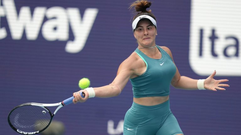 Bianca Andreescu, of Canada, returns a volley from Emma Raducanu, of Great Britain, in the first set of a match at the Miami Open tennis tournament, Wednesday, March 22, 2023, in Miami Gardens, Fla. (Jim Rassol/AP Photo)