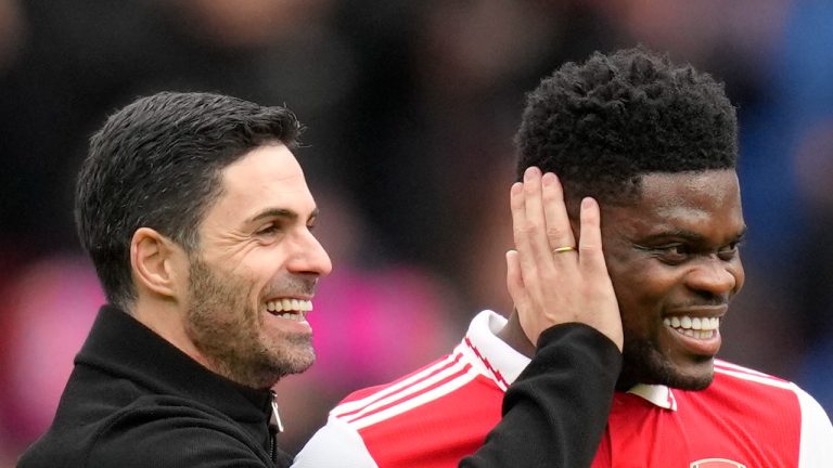 Arsenal's manager Mikel Arteta leaves the field with Arsenal's Thomas Partey at the end of the English Premier League soccer match between Arsenal and Crystal Palace at Emirates stadium in London, Sunday, March 19, 2023. (Kirsty Wigglesworth/AP Photo)