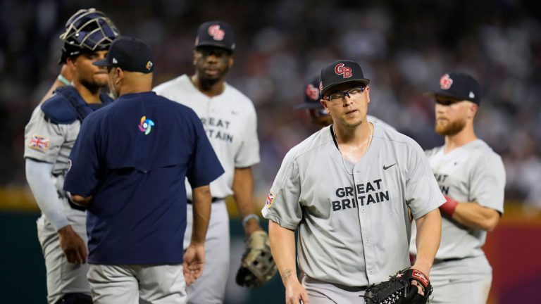 Great Britain pitcher Vance Worley, right, exits during the third inning of the team's World Baseball Classic game against the United States. (Godofredo A. Vásquez/AP)