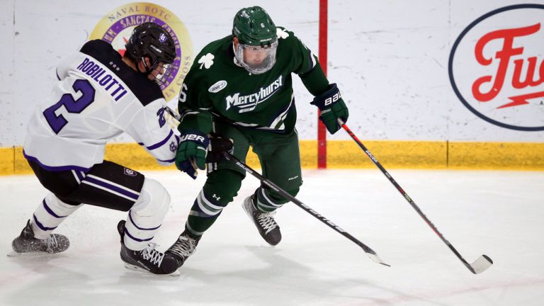 Holy Cross's Jack Robilotti (2) defends Mercyhurst's Carson Briere (6) during the first half of an NCAA hockey game. (Stew Milne/AP)