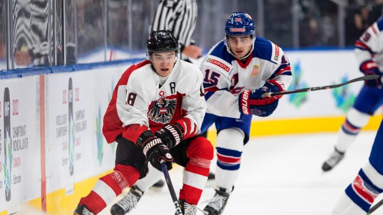 USA's Matthew Coronato (15) chases Austria's Martin Urbanek (18) during first period IIHF World Junior Hockey Championship action in Edmonton on Saturday August 13, 2022. (Jason Franson/THE CANADIAN PRESS)