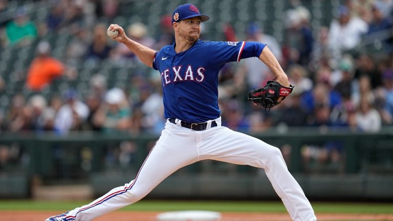 Texas Rangers starting pitcher Jacob deGrom delivers during the first inning of a spring training baseball game against the Seattle Mariners, Sunday, March 19, 2023, in Surprise, Ariz. (Abbie Parr/AP)