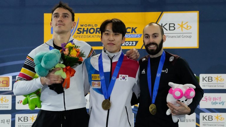 From left, silver medalist Stijn Desmet of Belgium, gold medalist Park Ji-won of South Korea and bronze medalist Steven Dubois of Canada pose during the award ceremony for the men's 1,000-meter at the ISU World Short Track Speed Skating Championships in Seoul, South Korea, Sunday, March 12, 2023. (Ahn Young-joon/AP)