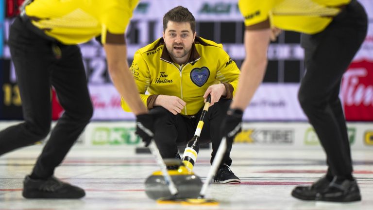 Manitoba's Matt Dunstone calls a sweep on a shot against Wild Card 1's Brendan Bottcher in the semifinal game at the 2023 Tim Hortons Brier in London, Ont., Sunday, March 12, 2023. (Frank Gunn/CP)