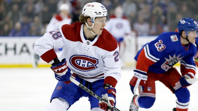 Montreal Canadiens center Christian Dvorak (28) looks to pass the puck in front of New York Rangers defenseman Adam Fox in the first period of an NHL hockey game Sunday, Jan. 15, 2023, in New York. (Adam Hunger/AP)