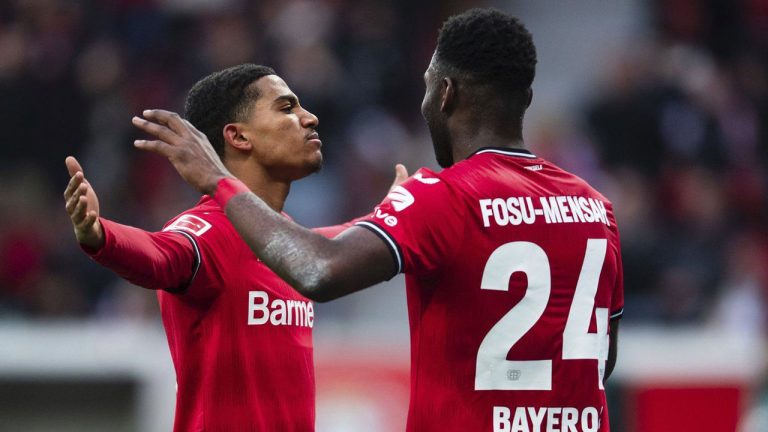 Leverkusen's goal scorer Amine Adli, left, celebrates with team mate Timothy Fosu-Mensah after scoring to 4-1 goal during the Bundesliga soccer match between Bayer Leverkusen and Hertha BSC at BayArena stadium. (Marius Becker/AP)