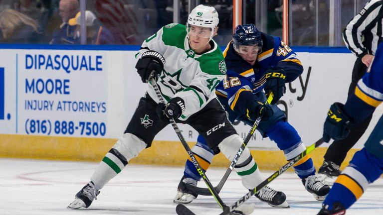 Dallas Stars center Jacob Peterson (40) passes the puck as St. Louis Blues center William Bitten (42) defends during the first period of an NHL hockey preseason game Saturday, Oct. 1, 2022, in Independence, Mo. (Nick Tre. Smith/AP)