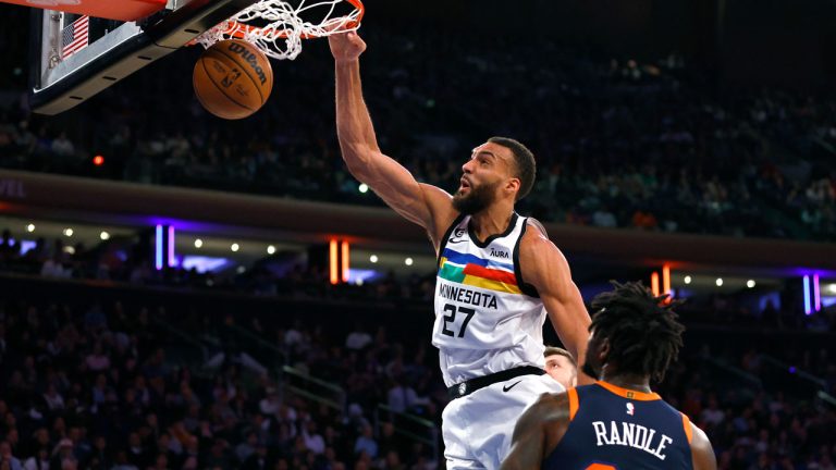 Minnesota Timberwolves center Rudy Gobert (27) dunks against New York Knicks forward Julius Randle (30) during the first half of an NBA basketball game. (Noah K. Murray/AP)