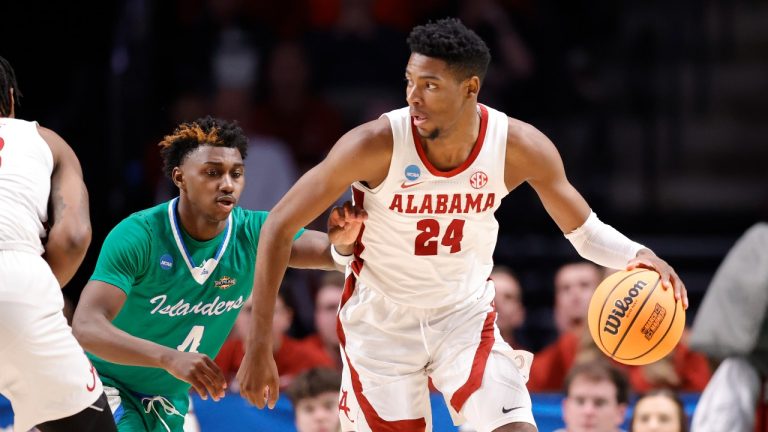 Brandon Miller #24 of the Alabama Crimson Tide dribbles the ball against Jalen Jackson #4 of the Texas A&M-CC Islanders during the second half in the first round of the NCAA Men's Basketball Tournament at Legacy Arena at the BJCC on March 16, 2023 in Birmingham, Alabama. (Photo by Alex Slitz/Getty Images)
