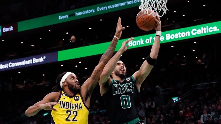 Boston Celtics' Jayson Tatum (0) shoots against Indiana Pacers' Isaiah Jackson (22) during the first half of an NBA game Friday, March 24, 2023, in Boston. (AP)