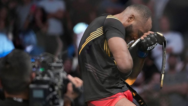 UFC fighter Leon Edwards, of Jamaica, celebrates his title as welterweight champion of the world after beating Nigerian UFC fighter Kamaru Usman. (Francisco Kjolseth/AP)