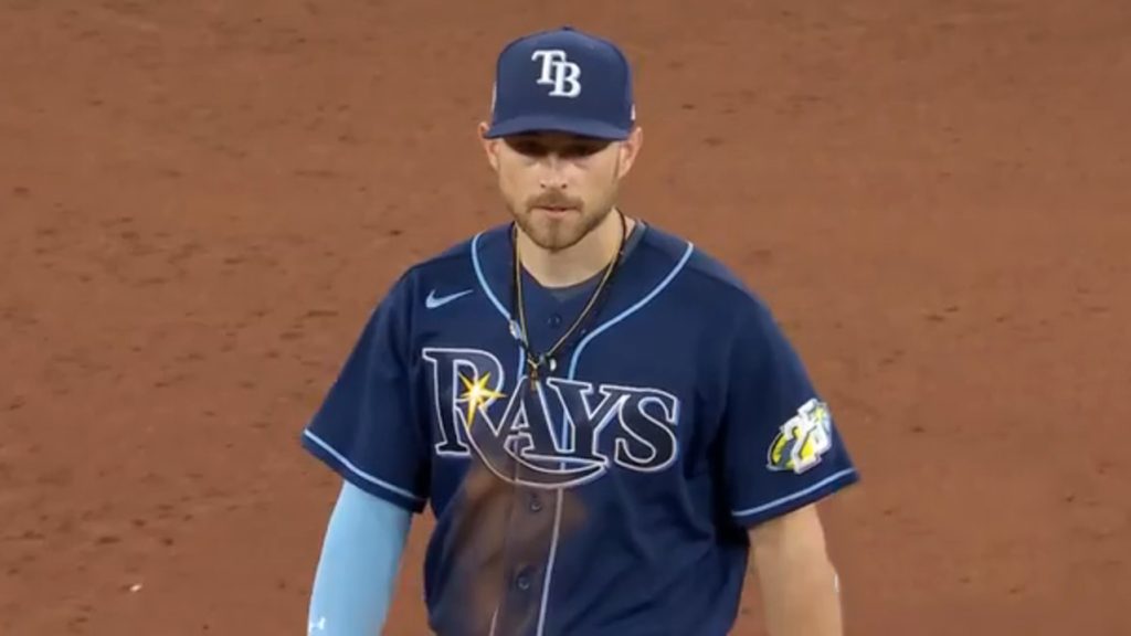 Tampa Bay Rays' Josh Lowe, left, tugs on the jersey of his brother