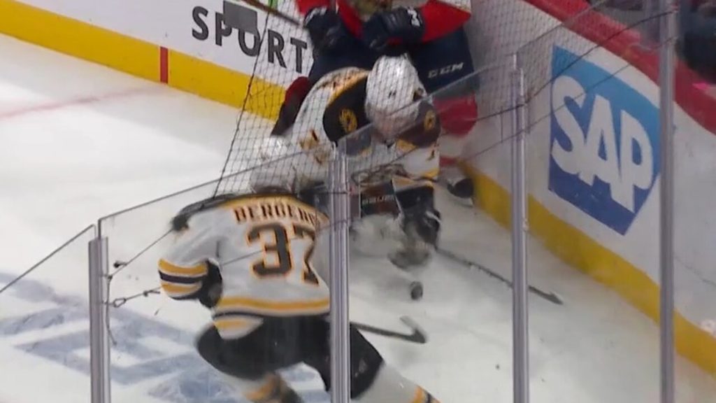 Jake DeBrusk reacts to hand-pass call that negated Carlo's goal in