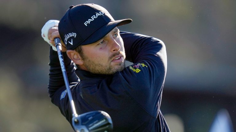 Adam Svensson, of Canada, watches his tee shot on the 10th hole of the North Course at Torrey Pines. (Gregory Bull/AP)