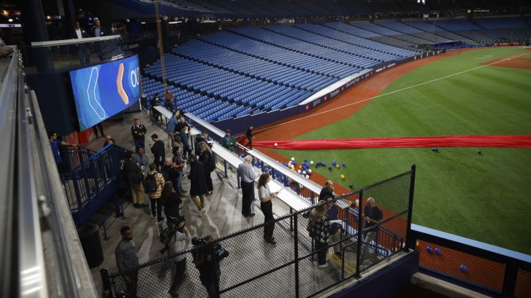 People tour one of the new landing areas by the visitors bullpen as renovations completed to the Rogers Centre stadium are unveiled during a tour, in Toronto, Thursday, April 6, 2023. (Cole Burston/CP)