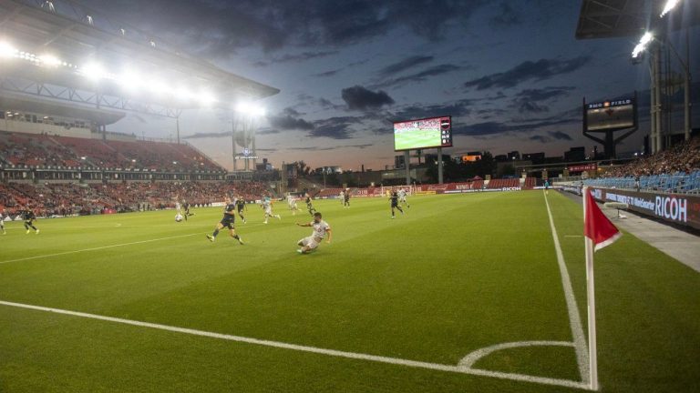 Toronto FC's Jonathan Osorio crosses the ball into the box as fans watch under the lights of BMO Field during second half MLS action against, Nashville SC in Toronto on Sunday, August 1, 2021. (Chris Young/CP Photo)