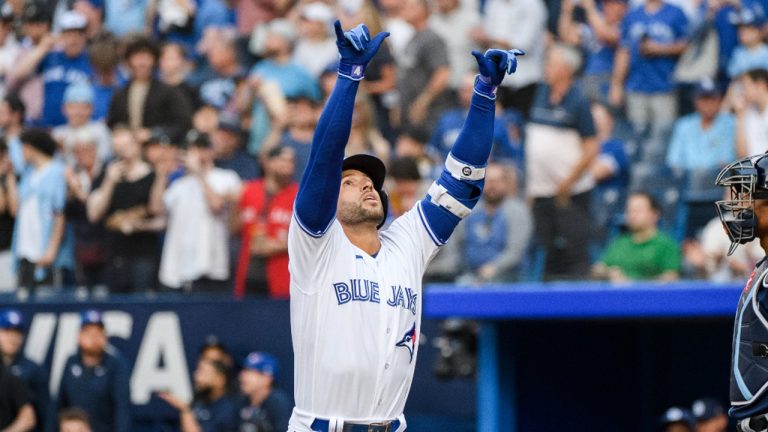 Toronto Blue Jays' George Springer (4) celebrates after hitting a solo home run during first inning MLB baseball action against the Tampa Bay Rays in Toronto on Friday, April 14, 2023. (Christopher Katsarov/CP)